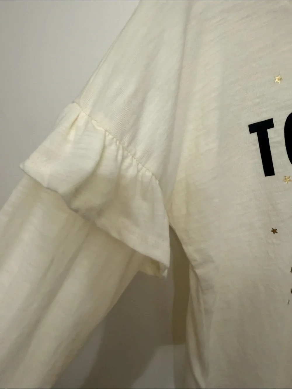 Old Navy Cream Long-Sleeve Tee with Black Text and Gold Stars